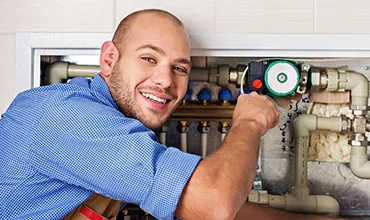 Master Fix Plumber Repairing A Heating System